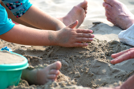Child playing on a beach, good activity and sport for health and mental healthの写真素材