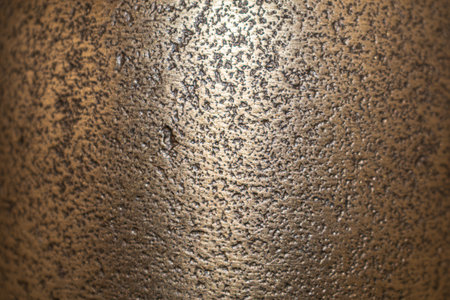 Golden background of an authentic image of an object, zoom on its texture for background and conceptの写真素材