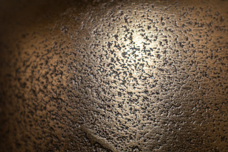 Golden background of an authentic image of an object, zoom on its texture for background and conceptの写真素材