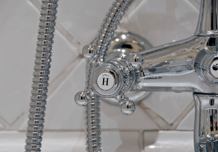 detail of a vintage victorian chrome hot water tap