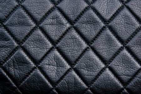 Diamond pattern black leather stitched with black thread
