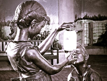 Children look at jarの写真素材