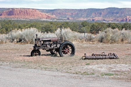 Antique Tractor and the mountainsの写真素材