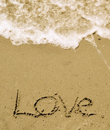 Love written in the sand with wave 37の写真素材