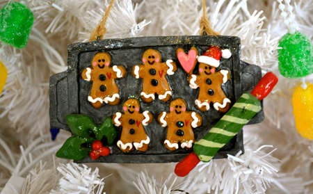 Gingergread ornament hanging on a tree

