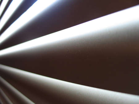 Light coming in from closed blindsの写真素材