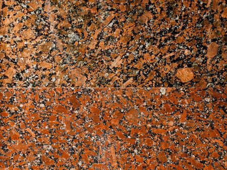Granite structure of two different colors, divided in the middleの写真素材