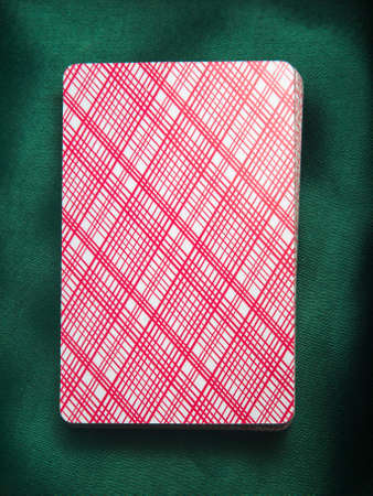 Playing cards on a green dress
