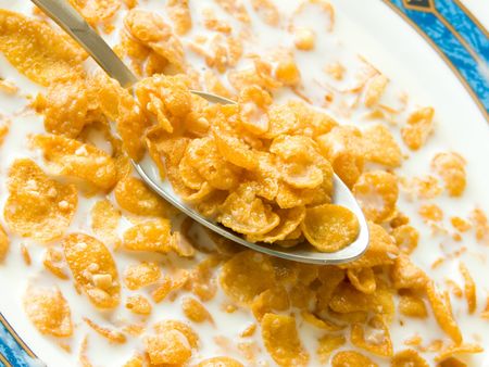Spoon with cornflakes. Shallow DOF.