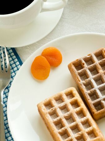 Coffee cup, wafers with apricots, cornflakes. Shallow dof.の写真素材
