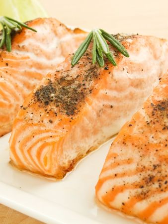 Plate with backed salmon steaks. Shallow dof.の写真素材
