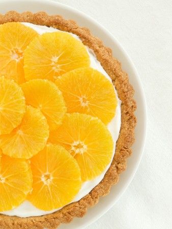 Plate with homemade orange tart, viewed from above.の写真素材