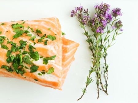 Plate with backed salmon and thyme bouquet. Shallow dof.の写真素材