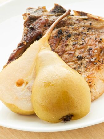Grilled pork steak with pears. Shallow dof.の写真素材