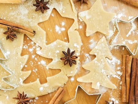 Christmas baking background: dough, cookie cutters and spices. Viewed from above.の写真素材