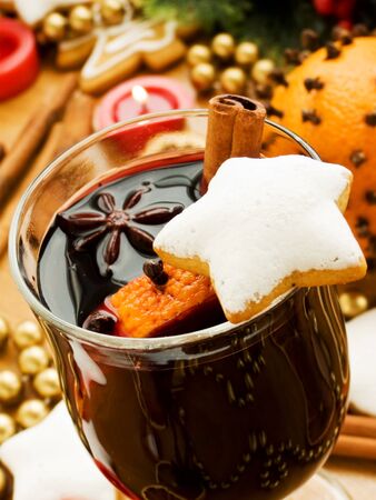 Mulled wine with slice of orange and spices. Shallow dof.の写真素材