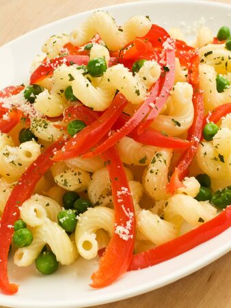 Italian pasta cavatappi with pepper and green peas. Shallow dof.の写真素材
