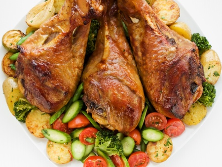 Roasted turkey legs with vegetables.の写真素材