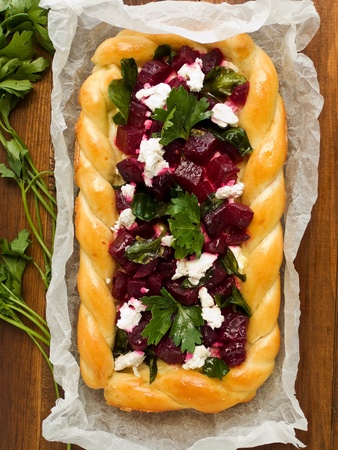 Homemade tart with cottage cheese, herbs and beet. Viewed from above.の写真素材