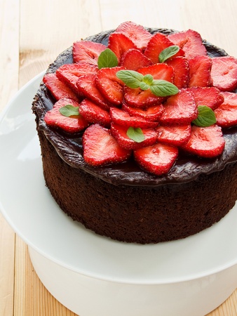 Homemade chocolate cake with strawberry and mint. Shallow dof.の写真素材