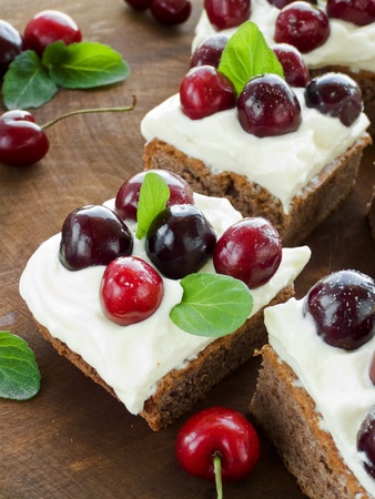 Cake with sweet cherries and whipped sour cream. Shallow dof.の写真素材