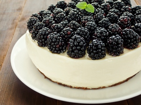 Sour cream cheesecake with blackberries. Shallow dof.の写真素材
