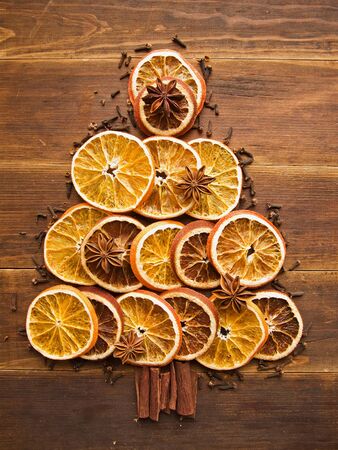 Christmas tree made of dried oranges, cinnamon and anise  Viewed from above の写真素材