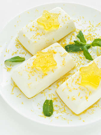 Cheesecakes with lemon jelly and stars. Shallow dof.の写真素材