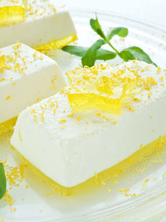 Cheesecakes with lemon jelly and stars. Shallow dof.の写真素材