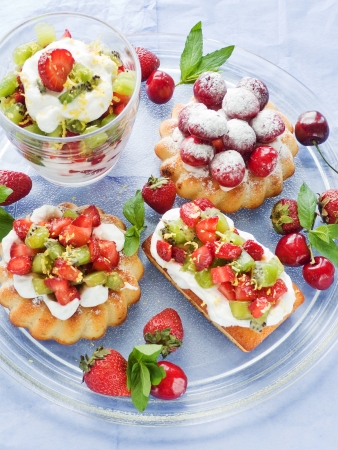 Plate with various kinds of fruit desserts.の写真素材