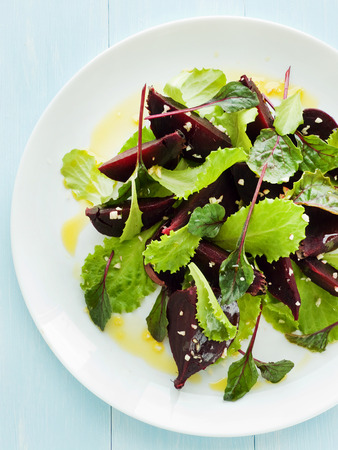 Plate with beet-lettuce salad. Shallow dof. 