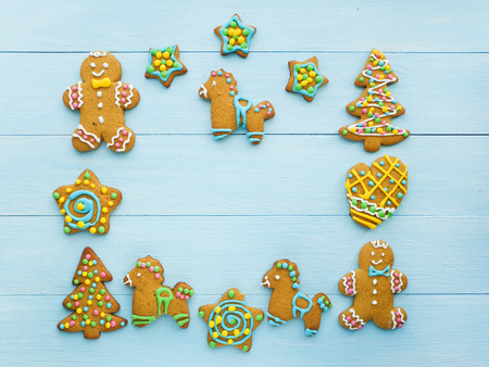 Christmas gingerbread cookies on the blue background. Viewed from above.