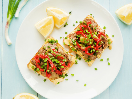 Toasts with mustard sauce, liver and stir-fry pepper. Viewed from above.の写真素材