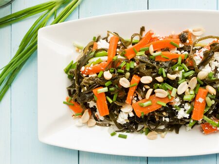 Salad with seaweed, cottage cheese, veggies and peanuts. Viewed from above.の写真素材