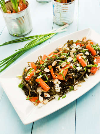 Salad with seaweed, cottage cheese, veggies and peanuts. Viewed from above.の写真素材