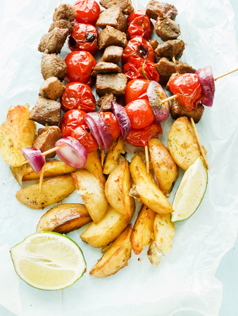 Pork kebabs and baked veggies. Shallow dof.の写真素材