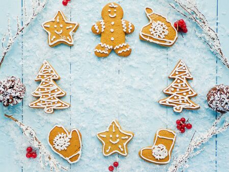 Christmas gingerbread cookies on the blue background. Shallow dof.