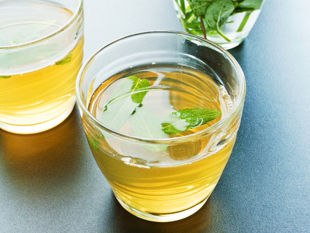 Green tea with mint in glasses. Shallow dof.の写真素材