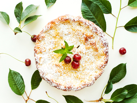 Fresh baked cherry pie with mint. Shallow dof.の写真素材