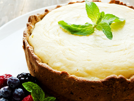 Cheesecake with berries and mint. Shallow dof.の写真素材