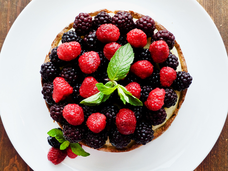 Cheesecake with berries and mint. Shallow dof.の写真素材