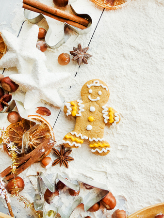 Christmas baking background: dough, cookie cutters, spices. Viewed from above.の写真素材