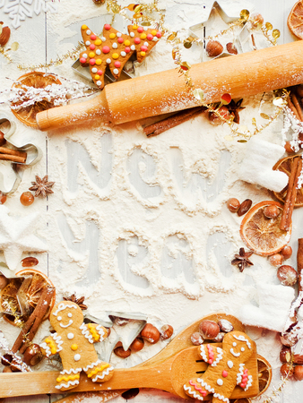 Christmas baking background: dough, cookie cutters, spices. Viewed from above.の写真素材