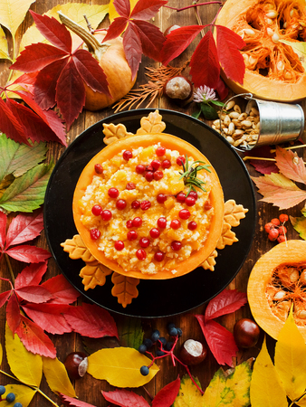 Rice pudding with pumpkin and berries. Shallow dof.の写真素材