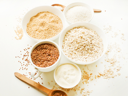 Different kinds of grain cereal in bowls.の写真素材