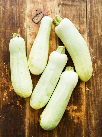 Marrow, Zucchini on wooden background. Shallow dof.の写真素材
