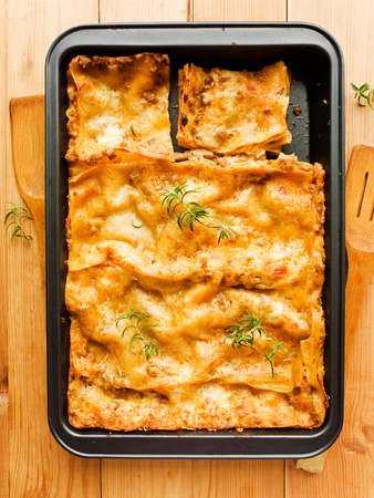 Traditional italian homemade lasagne with sauce and cheese. Shallow dof.