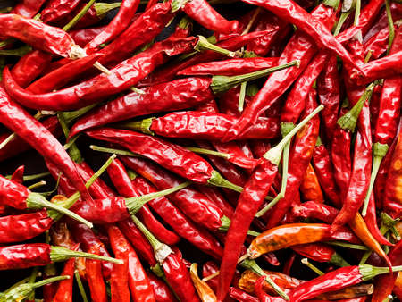Dried red hot chili pepper background. Top view. Shallow dof.