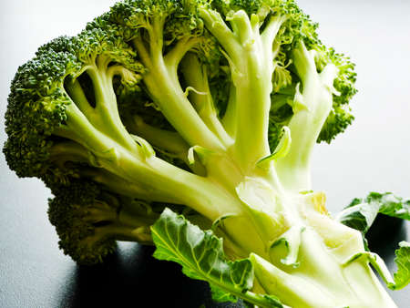 Broccoli cabbage on the black background. Shallow dof. Top view.の写真素材