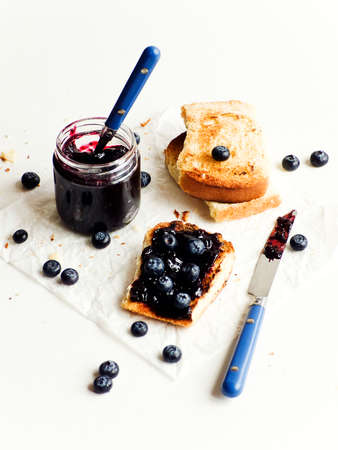 White bread toasts with blueberry jam. Shallow dof.